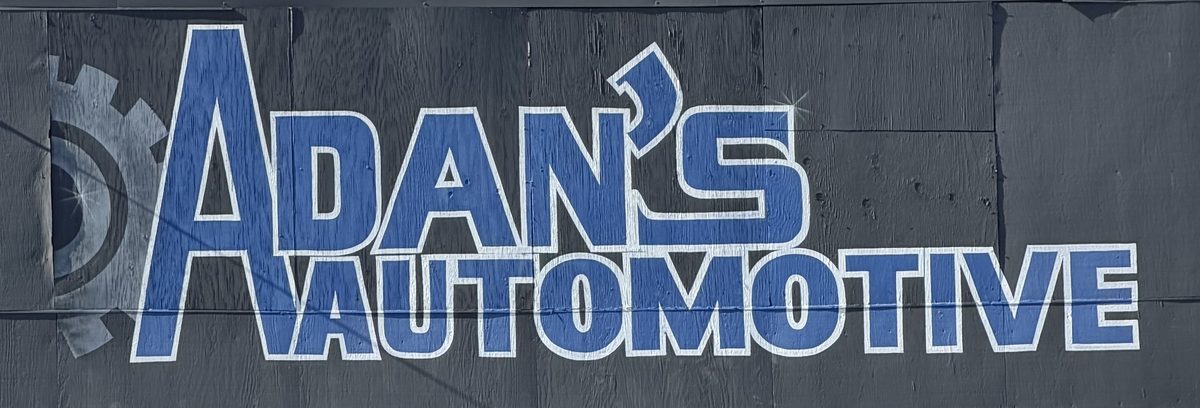 The hand-painted Adan's Automotive sign on the shop wall on Silverton Rd NE
